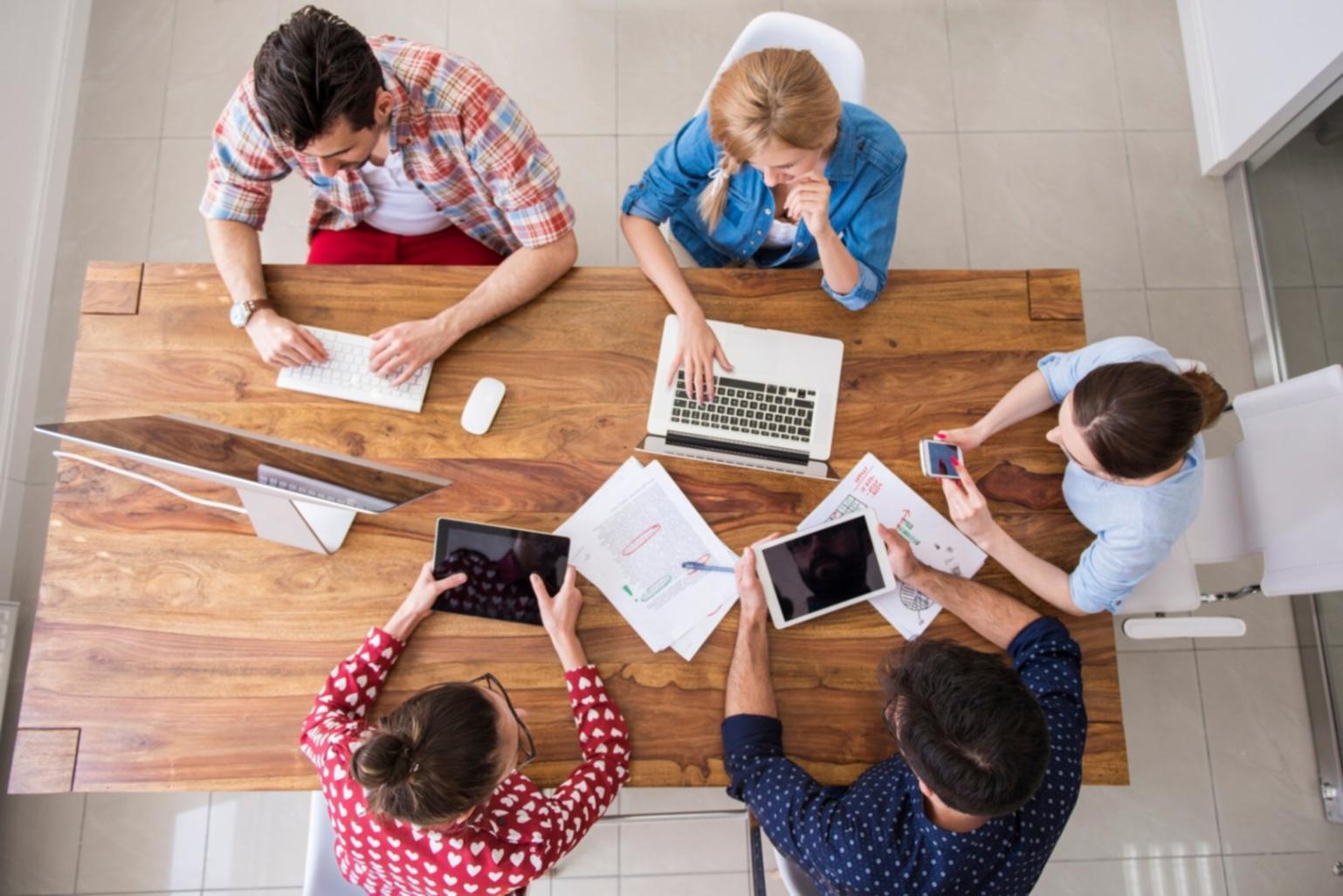 Participants reviewing personal finance materials and practical planning tools