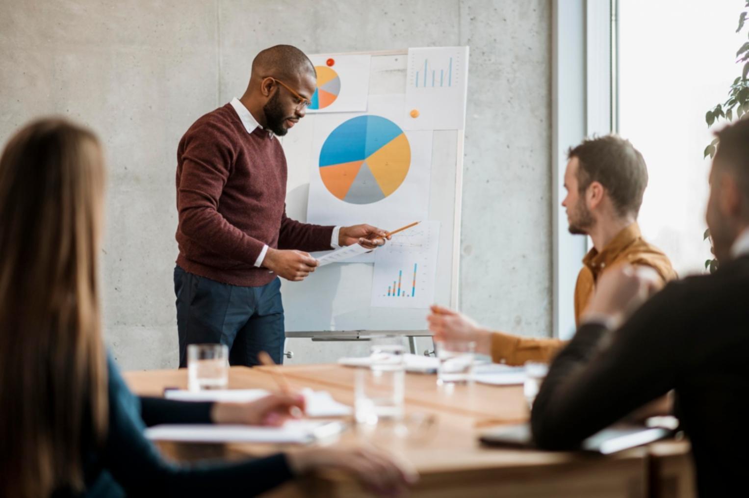 Small group discussion during financial planning workshop with collaborative learning approach
